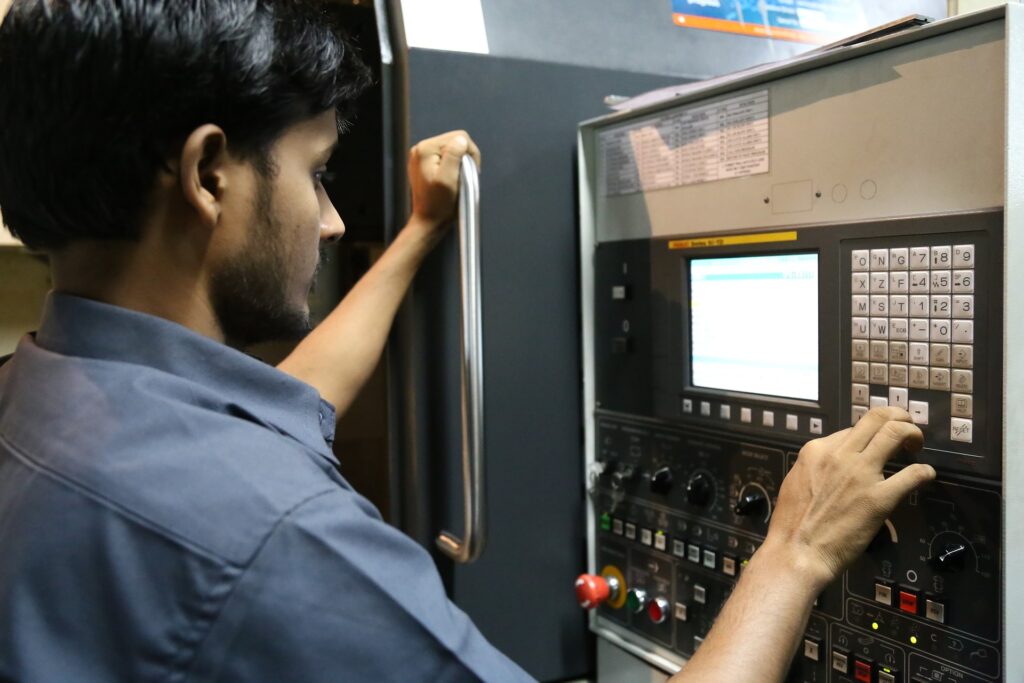 What does industry 4. 0 mean for cnc machining? Worker Using An Industry 4.0 Cnc Machine Interface